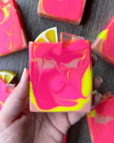 Pink Lemonade soap with Lemon and ice cube soap embeds on top.