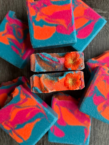 Sweet Nectar Hibiscus Salt Soap. Bold and bright teal, pink & orange bar with a Hibiscus flower on top. 