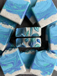 Aquamarine Dream Salt Bar is an oceanic scene with a beach & waves. Topped with soapy sea shells.